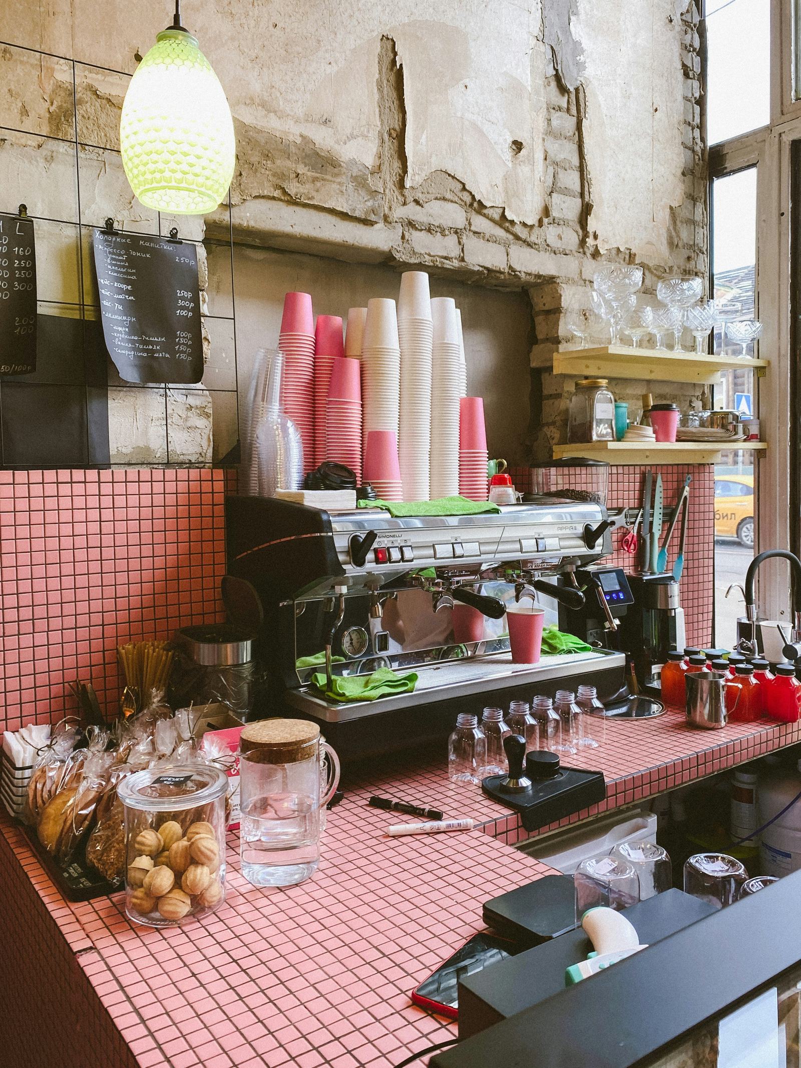 Blush Café interior — soft blush pink dining room with warm gold lighting